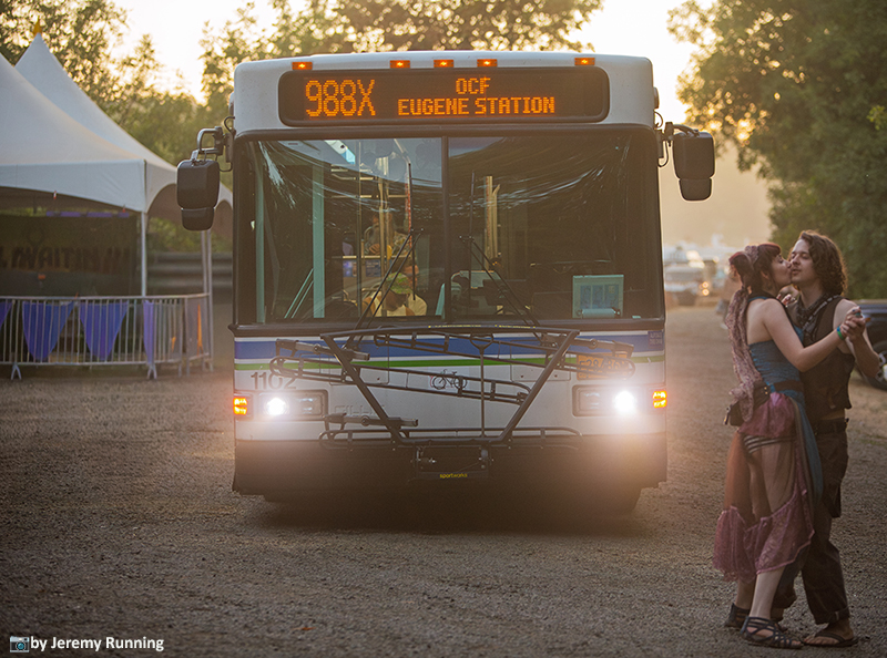 Fairgoers arriving by bus at the Oregon Country Fair.